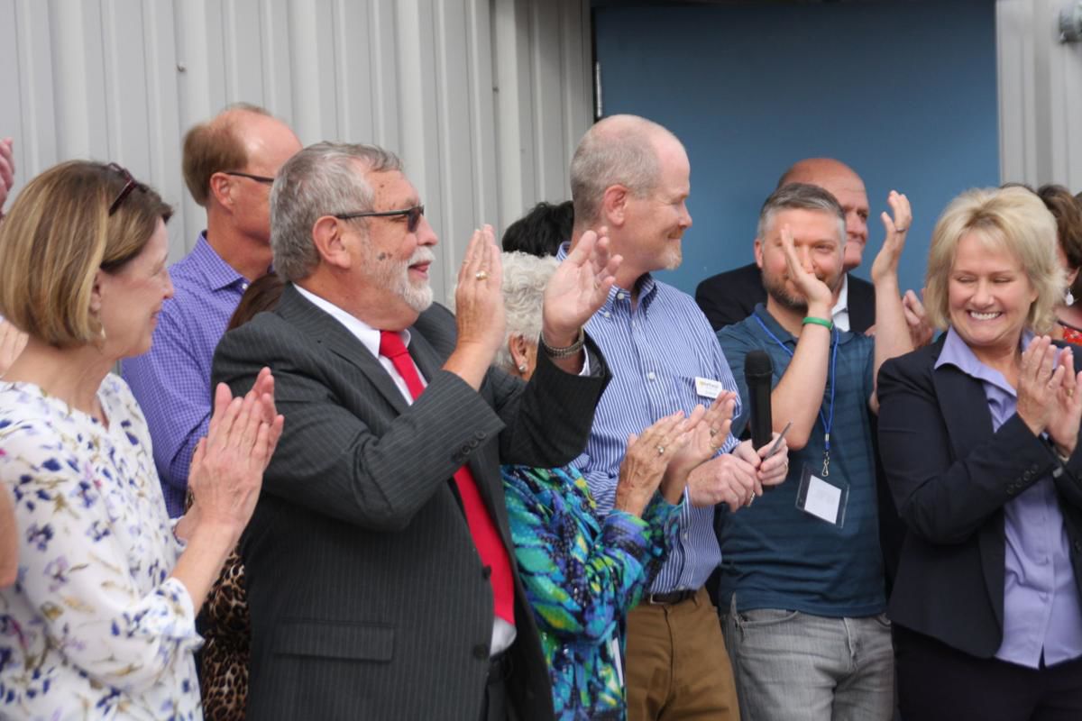 Longtime Northeast Community Fund leader Jerry Pelz surprised with honor at new facility's open house